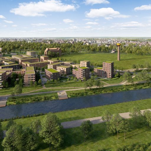 Luftansicht eines Wohnquartiers mit Backsteingebäuden, Grünflächen, Kanal und einem Wasserturm im Hintergrund.