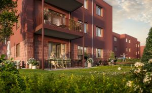 Wohnhaus in rot mit Rasen davor