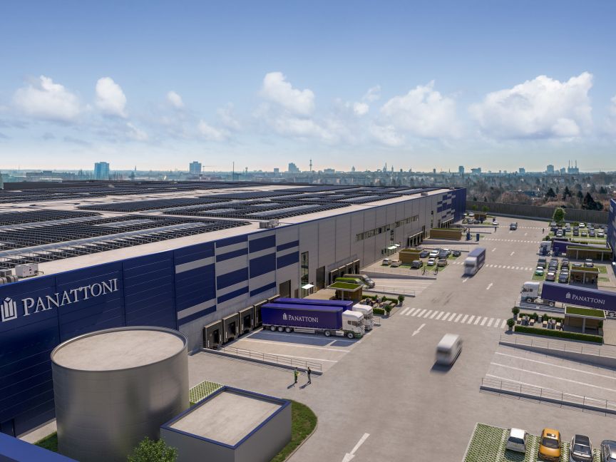 Luftansicht eines Panattoni-Logistikzentrums mit Lkw, Laderampen, Parkplätzen und Solarpaneelen auf dem Dach.