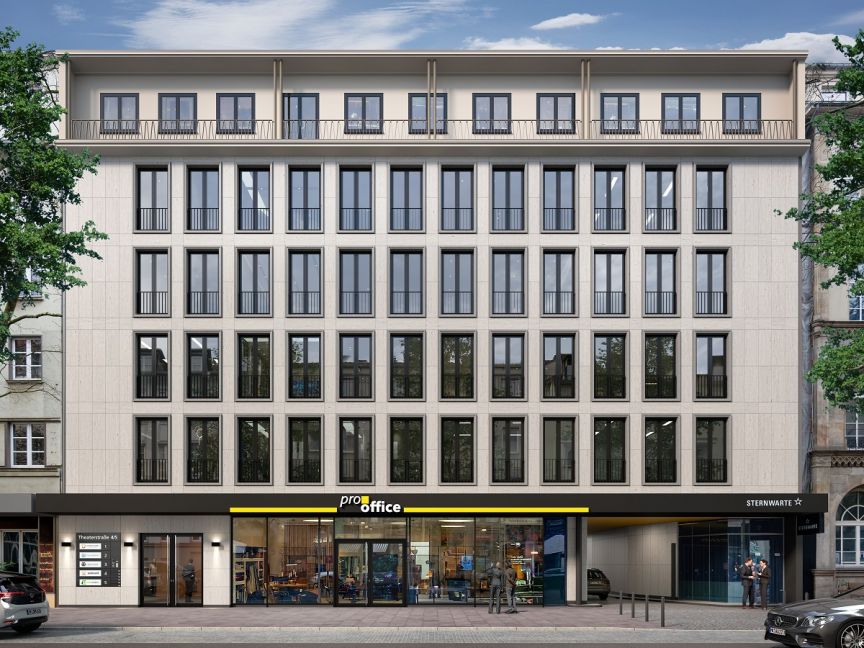 Mehrstöckiges Bürogebäude mit heller Fassade, großen Fenstern und einem „pro office"-Geschäft im Erdgeschoss.