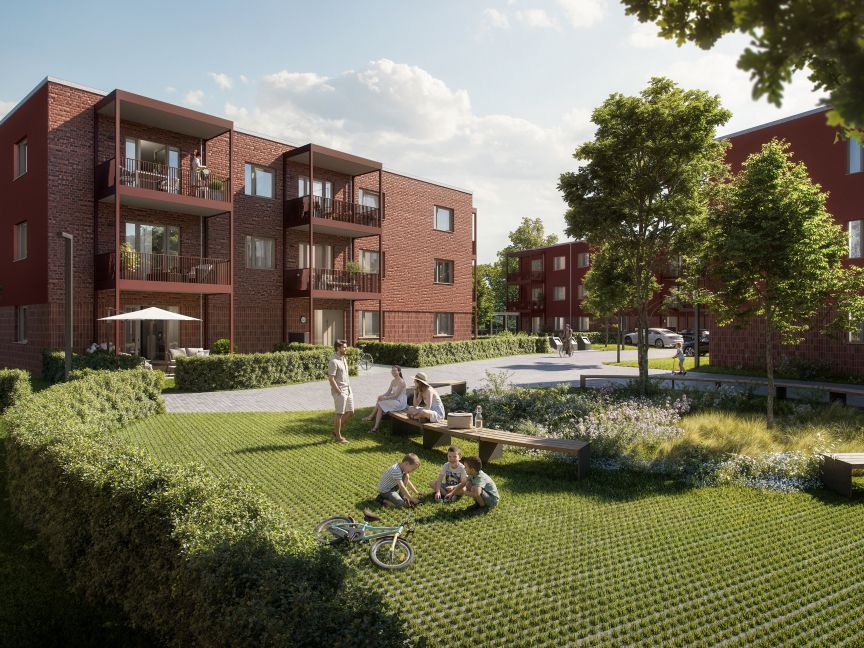 Wohnhaus in rot mit Garten und Bäumen