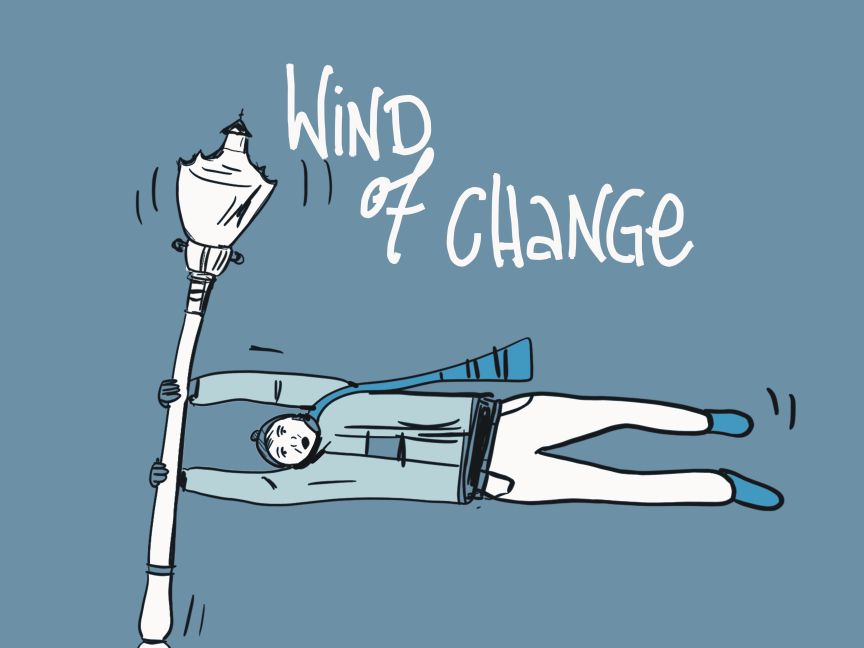 Wind of Change, ein Mann hängt an einer Laterne und wird weggeweht.