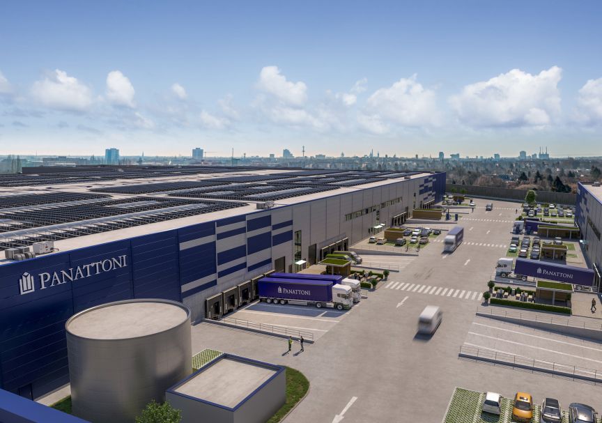 Luftansicht eines Panattoni-Logistikzentrums mit Lkw, Laderampen, Parkplätzen und Solarpaneelen auf dem Dach.