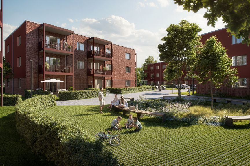 Wohnhaus in rot mit Garten und Bäumen