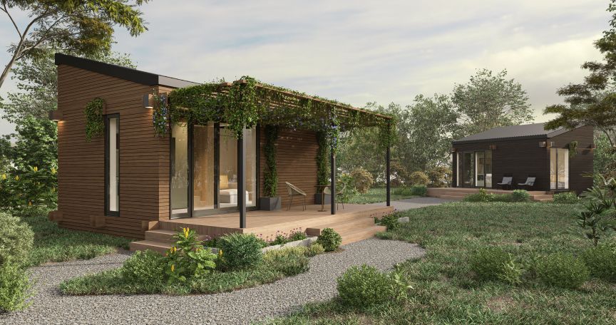 Modernes Holzhaus mit Pergola und Kletterpflanzen, Holzdeck, Kiesgarten, zweites dunkles Gebäude im Hintergrund.
