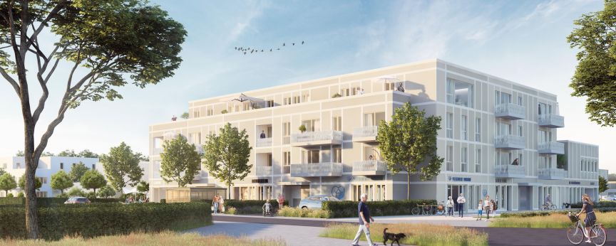 Modernes weißes Mehrfamilienhaus mit Balkonen, umgeben von Bäumen, Fußgängern und einem Radfahrer bei sonnigem Wetter.